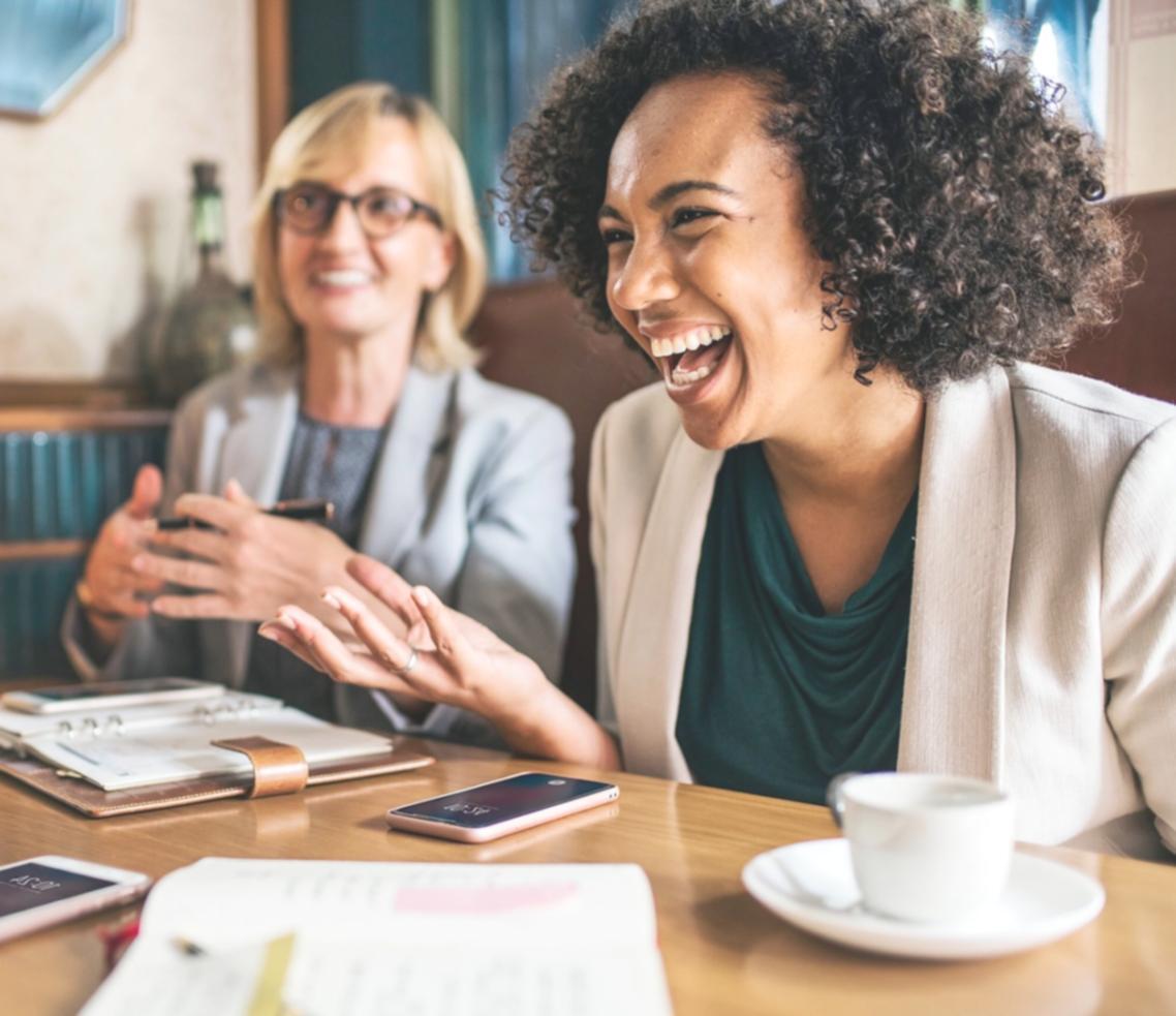 Students working on financial analysis projects using real company data and spreadsheet models